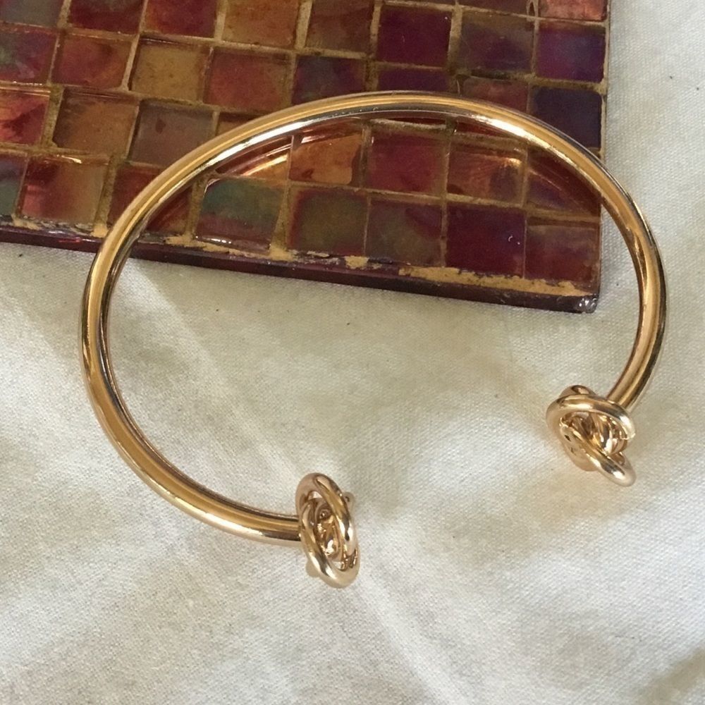 $8 ea or 3/$15. Goldtone Knotted Bangle Bracelet